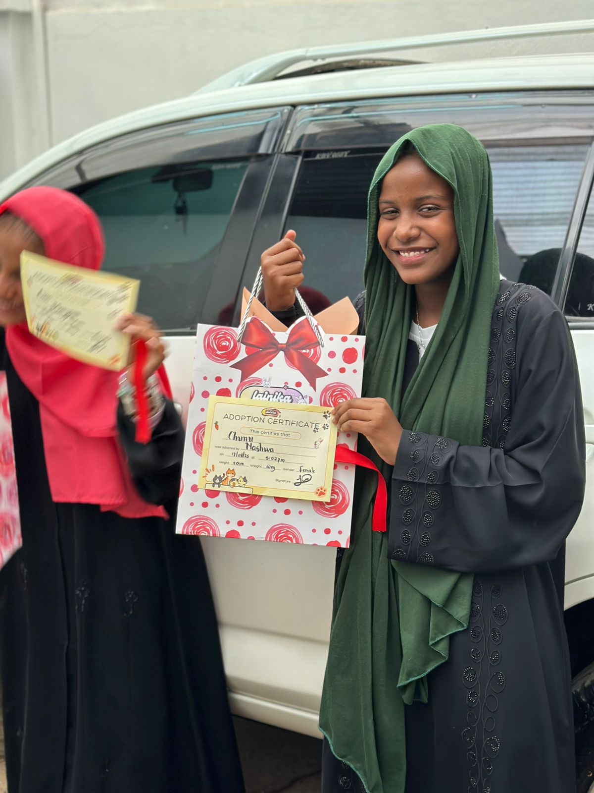 Two Young Girls with Premium Bags